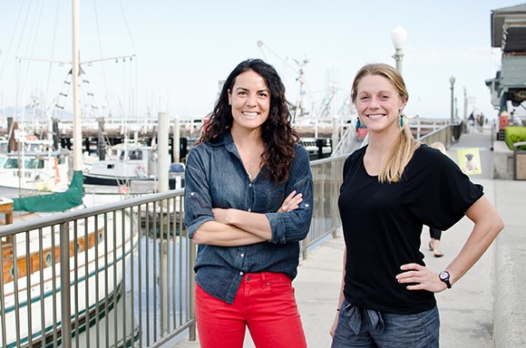 Norah Eddy, left, and Laura Johnson are founders of Salty Girl Seafood. The startup, spun out of the UC Santa Barbara Bren School of Environmental Science and Management, aims to make it easier for restaurants to source seafood directly from fishermen.  (Alex Drysdale / Business Times photo)