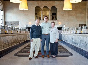 Al Barkley, left, and his son Griffin and wife Rebecca inside the historic Bank of A. Levy builing in downtown Oxnard. Al and Rebecca purchased and refurbished the property at 143 W Fifth St. and now lease it the family firm, Barkley Insurance & Risk Management.