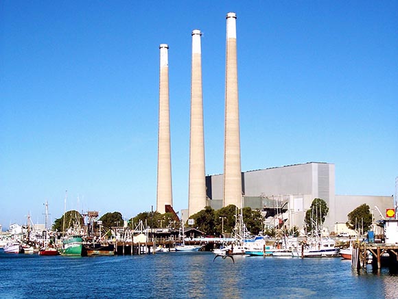 The exhaust stacks of the Dynegy Power Plant, stand over Morro Bay. On Feb. 24 the Houston-based company withdrew its offer to sell the site, along with plants in Oakland and Moss Landing. (Courtesy photo)