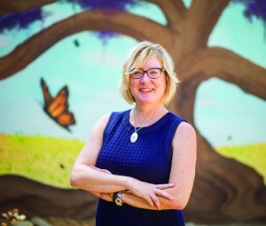 Museum of Ventura County CEO Pattie Mullins in front of the Chumash-themed Evelyn and Howard Boroughs Children’s Garden.