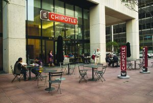 Customers dine outside at a Chipotle Mexican Grill.