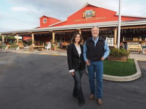 Incoming CEO Cara Crye and retiring CEO Jim Brabeck pose outside the Farm Supply Company store in San Luis Obispo. (Courtesy photo)